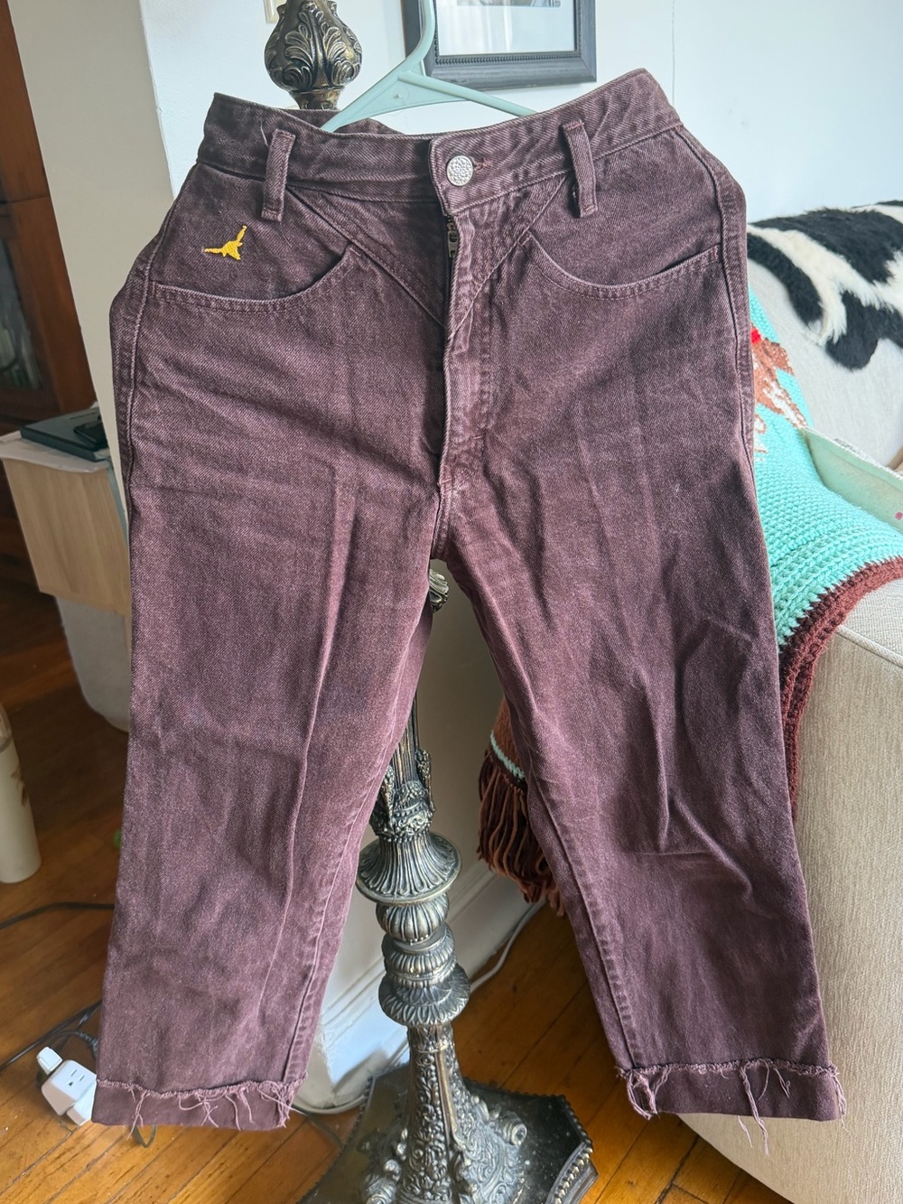 Vintage Bottoms brown jeans with yellow bull horn symbol
